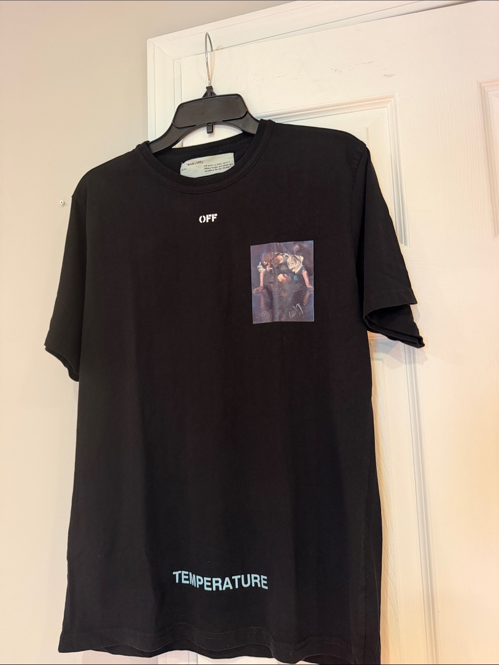 Off-White Black Crew Tee with Graphic Chest Patch and Blue 'TEMPERATURE' Hem